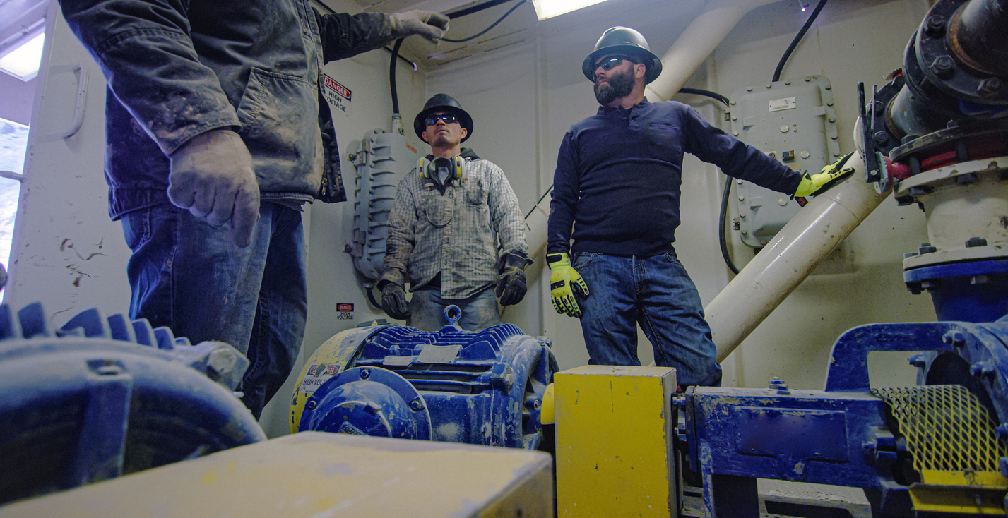 Kadios Energy Partners team collaborating in the field on an energy project
